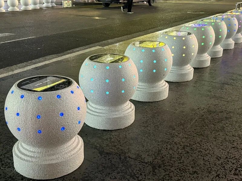 Stone bollards make phone charging convenient